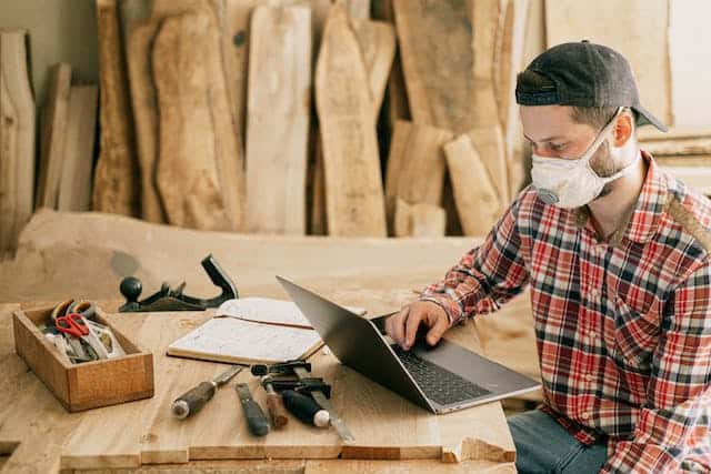 woodworker using laptap